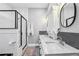 Modern bathroom with double sinks, sleek vanity, and a glass-enclosed shower at 1211 Mortimer Se Pl, Atlanta, GA 30317