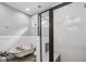 Bright bathroom with a clawfoot tub and glass enclosed shower at 1211 Mortimer Se Pl, Atlanta, GA 30317