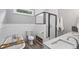 Bathroom showcasing a clawfoot tub, glass-enclosed shower, and modern fixtures at 1211 Mortimer Se Pl, Atlanta, GA 30317