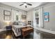 Bright bedroom with hardwood floors, neutral walls, and a ceiling fan at 1211 Mortimer Se Pl, Atlanta, GA 30317