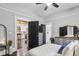 Bedroom featuring a modern kitchen view, ensuite bathroom, gray walls and dark wood floors at 1211 Mortimer Se Pl, Atlanta, GA 30317