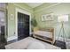 Bedroom bedroom with olive green walls and hardwood floors at 1211 Mortimer Se Pl, Atlanta, GA 30317
