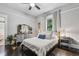 Serene bedroom with neutral colors, hardwood floors, and natural light streaming through the window at 1211 Mortimer Se Pl, Atlanta, GA 30317