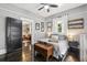 Comfortable bedroom with a cozy sitting area and a view into the living room at 1211 Mortimer Se Pl, Atlanta, GA 30317