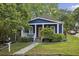 Charming blue home with a white porch and landscaped yard at 1211 Mortimer Se Pl, Atlanta, GA 30317
