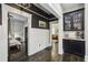 Hallway showcases dark hardwood floors, wainscoting, and a glimpse of living and bedrooms at 1211 Mortimer Se Pl, Atlanta, GA 30317