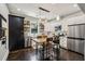 Well-lit kitchen with stainless steel appliances, white cabinets, and an eat-in area at 1211 Mortimer Se Pl, Atlanta, GA 30317