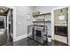 Laundry room with modern washer and dryer and overhead storage at 1211 Mortimer Se Pl, Atlanta, GA 30317