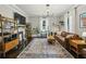 Bright living room boasting a decorative fireplace, hardwood floors, and natural light at 1211 Mortimer Se Pl, Atlanta, GA 30317