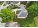 Aerial view of the house highlighting landscaping, driveway, and roof at 1316 Wind Chime Ct, Lawrenceville, GA 30045