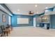 Entertainer's basement boasting plush carpets, a wet bar, and plenty of space for hosting and entertaining at 1316 Wind Chime Ct, Lawrenceville, GA 30045