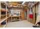 Unfinished basement space featuring a workbench, storage shelves, and exposed ceiling with ductwork and utilities at 1316 Wind Chime Ct, Lawrenceville, GA 30045