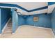 Finished basement space with plush carpet, stairway, and recessed lighting offering versatile living at 1316 Wind Chime Ct, Lawrenceville, GA 30045
