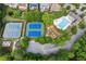 Aerial view of community featuring tennis courts and a community pool at 1316 Wind Chime Ct, Lawrenceville, GA 30045