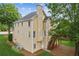 Exterior of the house with a view of the deck and large backyard at 1316 Wind Chime Ct, Lawrenceville, GA 30045