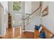 Bright, spacious foyer features hardwood floors, a staircase, and natural light streaming through the front door at 1316 Wind Chime Ct, Lawrenceville, GA 30045