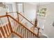 Grand foyer showcasing hardwood floors, staircase, and a view of the front entrance at 1316 Wind Chime Ct, Lawrenceville, GA 30045