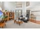 Open-concept living area boasts high ceilings, a cozy seating arrangement, and easy access to the kitchen at 1316 Wind Chime Ct, Lawrenceville, GA 30045