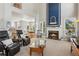Inviting living room features a fireplace, comfortable seating, and a seamless flow to the dining area at 1316 Wind Chime Ct, Lawrenceville, GA 30045
