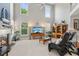 Spacious living room featuring tall ceilings, a cozy fireplace, and large windows for ample natural light at 1316 Wind Chime Ct, Lawrenceville, GA 30045