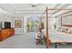 Spacious main bedroom featuring trey ceilings, a four poster bed, and natural light at 1316 Wind Chime Ct, Lawrenceville, GA 30045