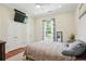 Inviting bedroom featuring a TV, large windows, plush carpet, and natural light at 2610 Cheney St, Atlanta, GA 30344