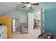 Bright bedroom featuring a walk-in closet, chair, and ceiling fan at 2610 Cheney St, Atlanta, GA 30344