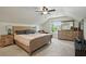 Spacious bedroom with vaulted ceilings, ample lighting, wooden furnishings, and a large bed at 2610 Cheney St, Atlanta, GA 30344