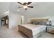 Large bedroom under angled roof, featuring neutral carpet, double bed, and matching dresser and night stands at 2610 Cheney St, Atlanta, GA 30344