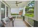 Inviting front porch with rocking chairs, ceiling fan, and views of the neighborhood at 2610 Cheney St, Atlanta, GA 30344