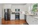 Well-equipped kitchen with white cabinets, stainless steel appliances, and bright lighting at 2610 Cheney St, Atlanta, GA 30344