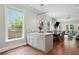 Open-concept view of island, dining area, and living area filled with natural light at 2610 Cheney St, Atlanta, GA 30344