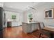 Modern kitchen featuring white cabinets, stainless steel appliances, and a gray island with a marble countertop at 2610 Cheney St, Atlanta, GA 30344