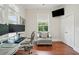 Bright office space with hardwood floors, large windows, and an ergonomic desk setup and chair at 2610 Cheney St, Atlanta, GA 30344