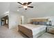 Comfortable bedroom featuring soft carpet, a large window, and rustic wood furniture creating a relaxing atmosphere at 2610 Cheney St, East Point, GA 30344