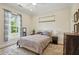 Comfortable bedroom with soft carpet, natural light from the window, and a serene atmosphere for relaxation at 2610 Cheney St, East Point, GA 30344
