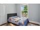 Compact bedroom with a single bed, a large window, and a cozy feel, perfect for a room or guest space at 2610 Cheney St, East Point, GA 30344