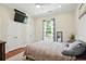 Bright bedroom with a plush rug, ample closet space and natural light from a large window at 2610 Cheney St, East Point, GA 30344