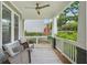 Inviting front porch featuring comfortable seating, ceiling fan, and a tranquil outdoor space at 2610 Cheney St, East Point, GA 30344