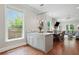 Stylish kitchen island with seating and an open view of the living and dining areas at 2610 Cheney St, East Point, GA 30344