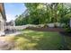 Large backyard with lush green lawn, patio, and beautiful landscaping, perfect for outdoor enjoyment at 2800 Tuscany Park Dr, Lawrenceville, GA 30043