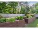 Landscaped backyard with wood retaining wall at 2800 Tuscany Park Dr, Lawrenceville, GA 30043