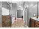 Bright bathroom with a glass shower, tub and a view of the cabinets and doors at 2800 Tuscany Park Dr, Lawrenceville, GA 30043