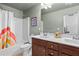 Well-lit bathroom with a dual sink vanity, a shower-tub combo, and a fresh, clean ambiance at 2800 Tuscany Park Dr, Lawrenceville, GA 30043