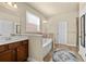 Bathroom featuring a soaking tub, dark wood vanity, and separate shower, creating a relaxing retreat at 2800 Tuscany Park Dr, Lawrenceville, GA 30043