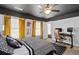 Bedroom features a black ceiling, office space, and decorative giraffe artwork creating a functional and stylish room at 2800 Tuscany Park Dr, Lawrenceville, GA 30043