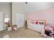 Bright, playful bedroom featuring unique decor with a ceiling fan and plenty of natural light at 2800 Tuscany Park Dr, Lawrenceville, GA 30043
