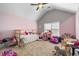 Bright, playful bedroom featuring unique decor with a ceiling fan and plenty of natural light at 2800 Tuscany Park Dr, Lawrenceville, GA 30043