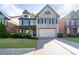 Charming two-story brick home with a well-manicured front yard and a two-car garage at 2800 Tuscany Park Dr, Lawrenceville, GA 30043