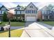 Attractive brick home featuring a well-maintained lawn, landscaping, and a convenient two-car garage at 2800 Tuscany Park Dr, Lawrenceville, GA 30043
